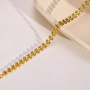 Detailed view of dainty gold heart chain necklace with shiny metallic link finish