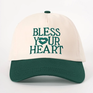 Vintage baseball cap in beige and green featuring heart embroidery and Bless Your Heart text
