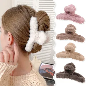 Large plush claw hair clips in various warm colors for thick hair winter styling