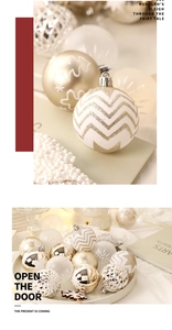 Detailed view of champagne gold and white Christmas balls with glitter snowflake patterns