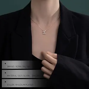 Elegant 925 sterling silver letter L necklace with zircon worn on a female model