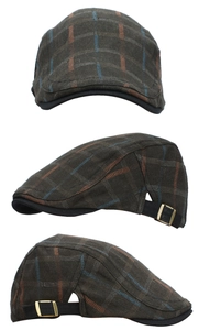 Detailed view of vintage plaid flat cap with side metal adjustment buckle in dark patterns