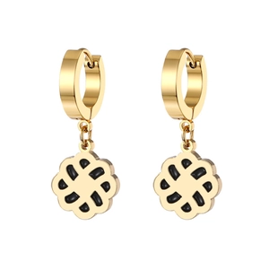 Detail of gold clover drop earrings with black enamel inlay and clicker hoops