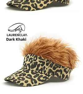 Detail of dark khaki leopard print visor featuring realistic synthetic brown hair wig