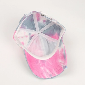Detail of pink tie-dye baseball cap interior with cotton fabric and adjustable buckle