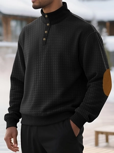 Detailed macro view of waffle texture fabric and faux suede elbow patches on sweatshirt