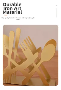 Detail of golden iron tissue holder with cutout cutlery design and rustproof finish
