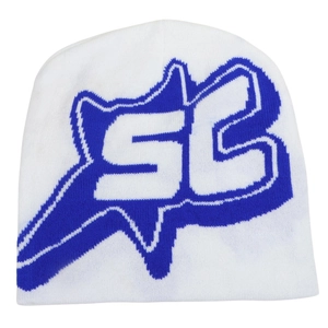 Detailed knit texture of white beanie with blue jacquard SB letter pattern