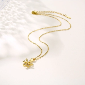 French style gold flower pendant necklace with cubic zirconia on a delicate O-chain