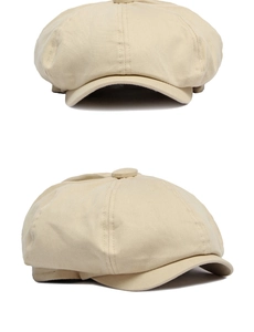 Close-up of beige cotton newsboy cap showing twill texture and classic 8-panel top