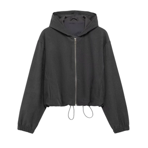 Detail of black cropped drawstring zip-up hoodie with elastic cuffs and metal zipper