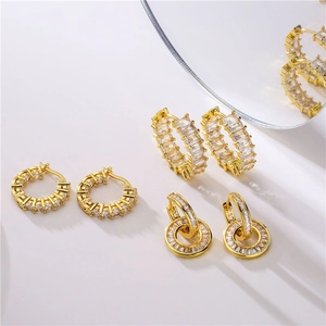 Chic gold-plated hoop earrings set with micro-pave cubic zirconia on a white background