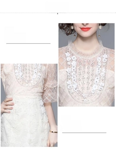 Détails du col fleuri perlé et de la broderie à la taille sur la robe en dentelle écrue