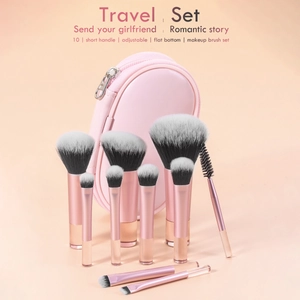 Pink travel makeup brush set of 10 pieces with a round zippered storage case and metallic handles