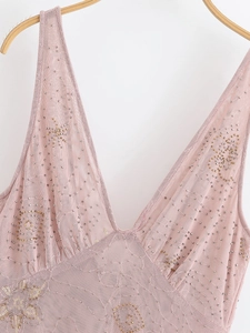 Detail of pink sequin midi dress featuring V-neckline and intricate bead embroidery