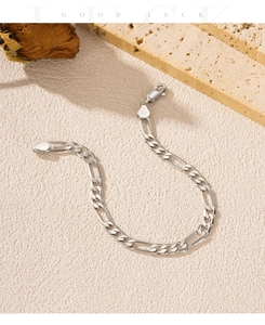 Close-up of S925 sterling silver Figaro bracelet showing 925 hallmark and link chain details