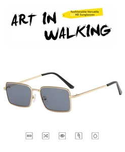 Detail of vintage square sunglasses with gold metal frame, silicone nose pads, and grey lenses