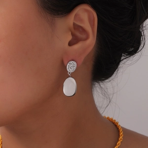 Modern double-layered silver stud earrings with sparkling crystals and polished oval charms