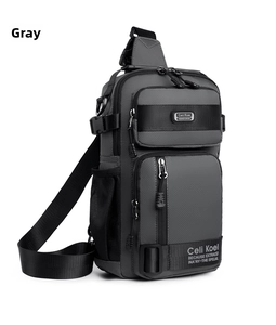 Detail of grey tactical chest bag showing durable nylon texture and double main compartments