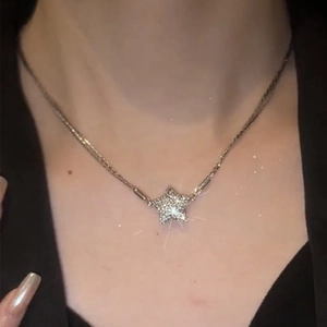 Sparkling magnetic star pendant necklace in stainless steel with crystals on neck