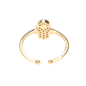 Detail of a golden Hamsa hand ring with zircon inlay and adjustable open band design