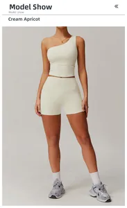 Ensemble de yoga deux pièces abricot crème avec brassière asymétrique et short taille haute