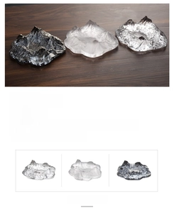 Detailed macro view of Mount Fuji glass ashtray in clear, frosted and dark grey finishes