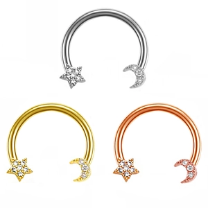 Three horseshoe rings with zircon star and moon ends in silver, gold, and rose gold