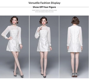Close-up of white jacquard dress featuring elegant floral embroidery and mesh sleeves