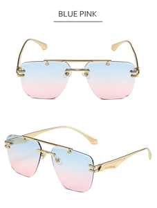 Detail view of rimless sunglasses with blue-pink gradient lenses and gold metal frames