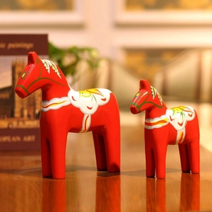 European luxury red Dala horse statues set with hand-painted Nordic folk art patterns