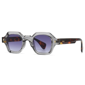 Modern hexagonal sunglasses with transparent grey frame and purple gradient lenses