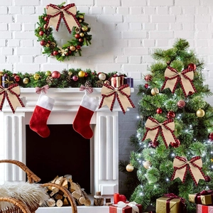 Close-up of burlap Christmas bows with red plaid edges on a decorated holiday tree