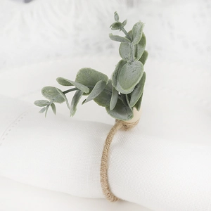 Eucalyptus leaf napkin ring with frosted greenery and jute rope for table decor