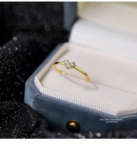 Macro shot of S925 sterling silver heart ring with micro-set zircon on jewelry box