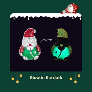 Luminous S925 silver Santa Claus charm showing glow-in-the-dark enamel effect