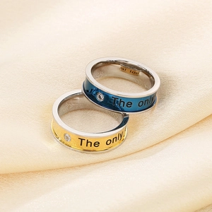 Couples stainless steel rings with 'The only' engraving and crystal inlay on silk