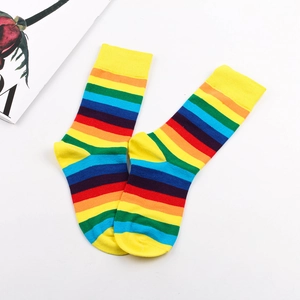 Detailed top view of colorful rainbow striped crew socks with yellow heels and toes