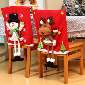 Christmas chair covers featuring snowman and reindeer 3D designs in festive home setting