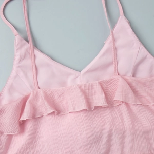 Detail of pink ruffle strap top with crinkle plissé texture and layered frills