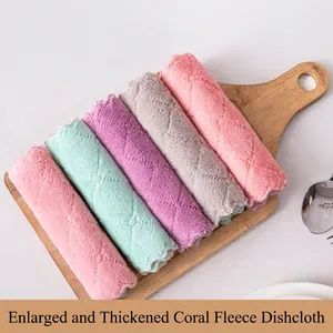 Thick coral fleece cleaning cloths in five colors neatly rolled on a wooden board