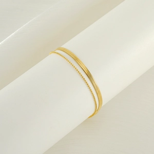 Double-layer snake bone and beaded anklet in 18k gold-plated stainless steel