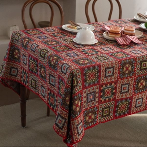 Red Christmas jacquard tablecloth featuring vintage geometric square patterns on dining table