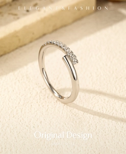 Detailed macro shot of an elegant S925 silver ring featuring small paved moissanite stones