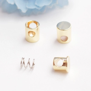 Macro view of 14K gold filled adjustable slider clasp with internal spring components