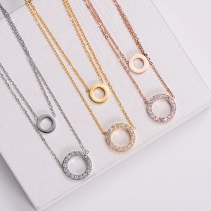 Three 18K gold plated double-layer necklaces with sparkling zircon circles on white stands
