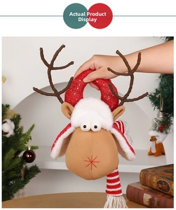 Detail of Christmas reindeer plush decor with sequined red antlers and striped scarf