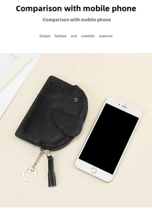 Mini cowhide leather elephant coin purse next to a smartphone for size comparison