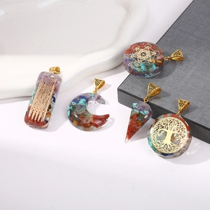 Chakra resin pendants with natural crystals and golden tree of life symbols set