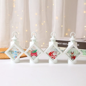 Set of 4 white Christmas LED lanterns with Santa and snowman patterns for holiday decor
